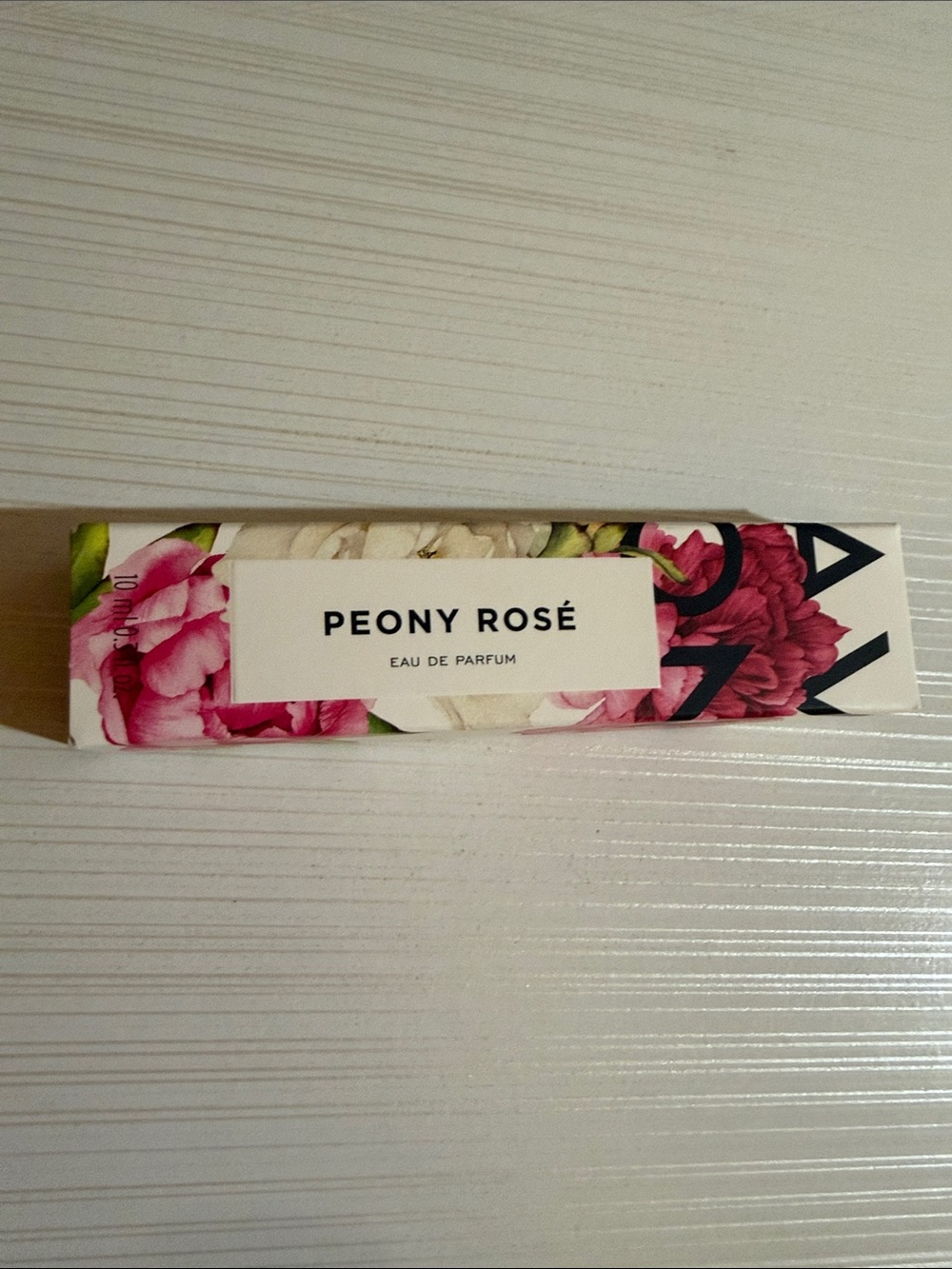 Avon Peony Rosé Eau de Parfum, a 0.3 fl oz travel-size